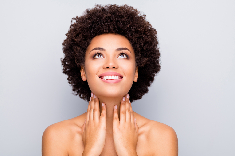 woman smiling with glowing skin