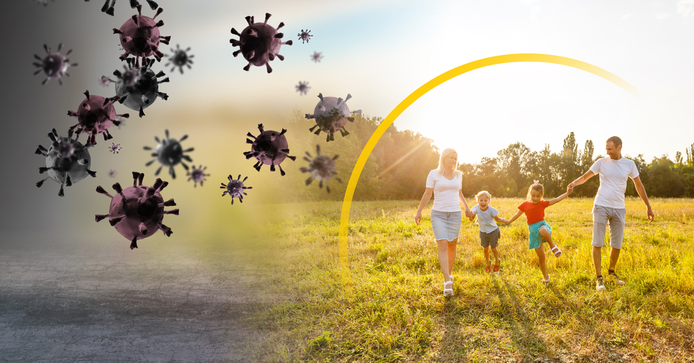 family enjoying sunny day outside protected from viruses