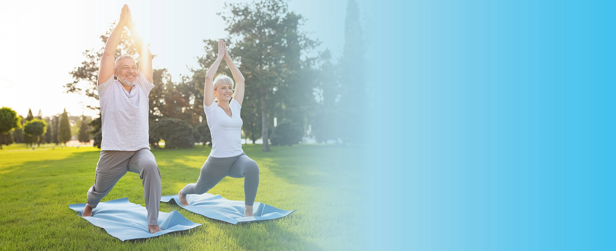 older couple doing yoga outside