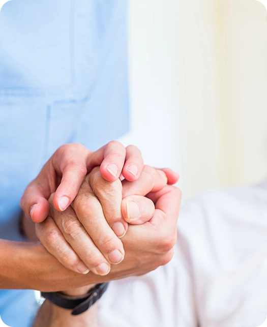 nurse holding patient's hand