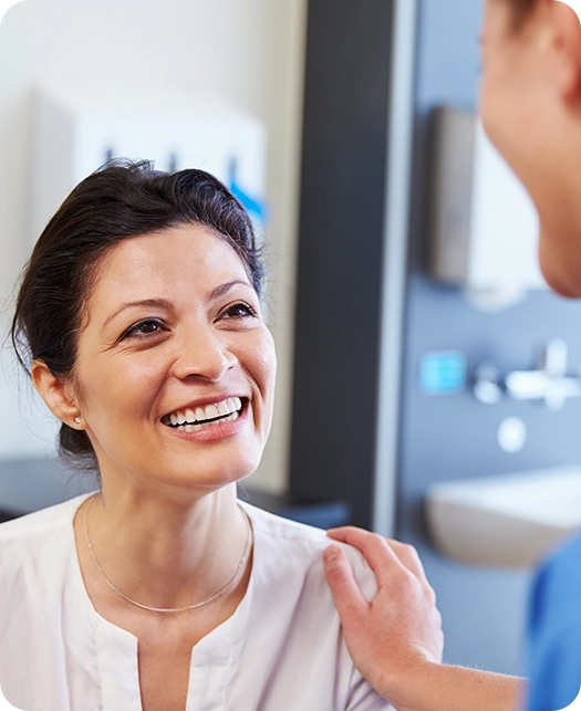 smiling woman consulting with medical professional