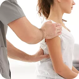 doctor with hands on woman's shoulder