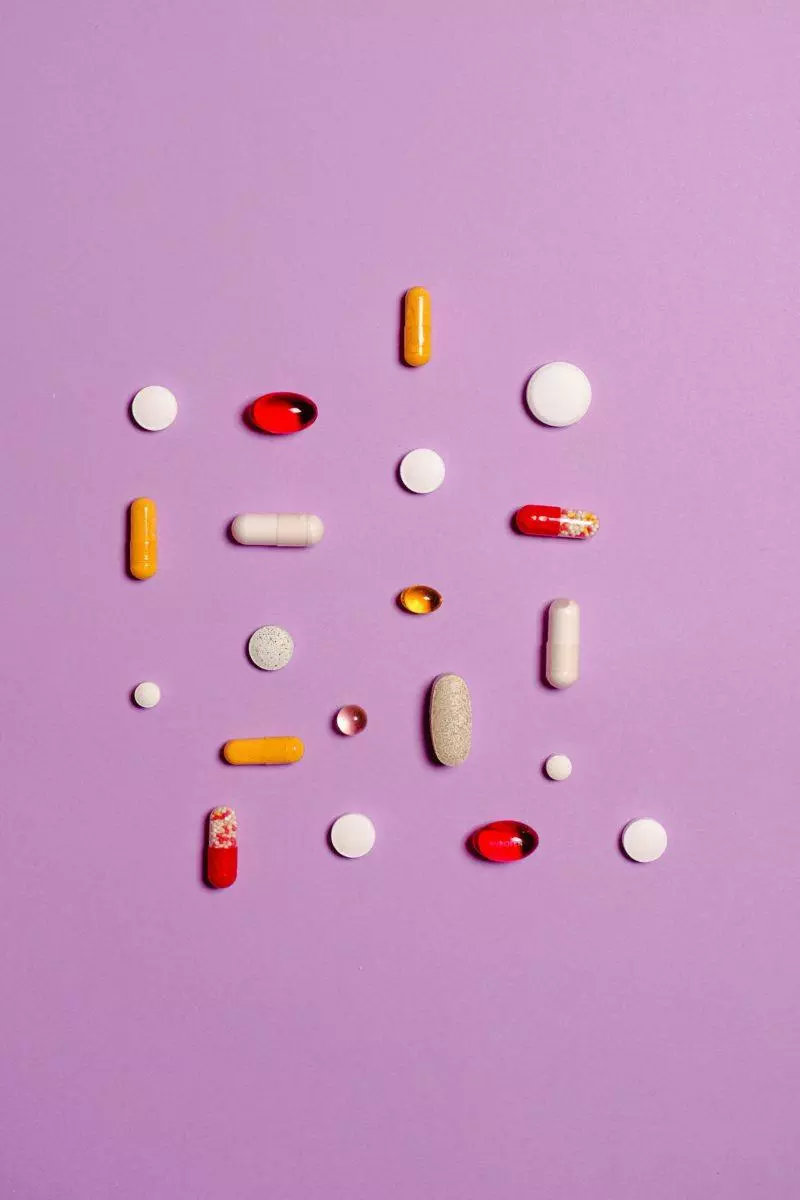 supplements pills with pink background