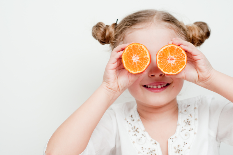 girl with oranges