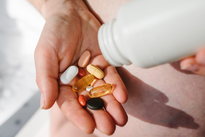 supplements in woman's hand