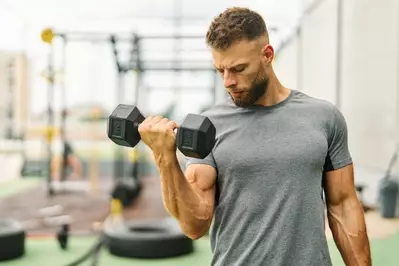 man lifting weights