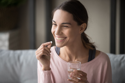 woman taking vitamin